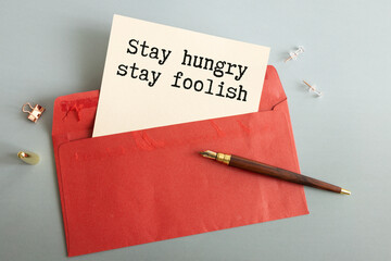 'Stay hungry stay foolish' quote or phase with black