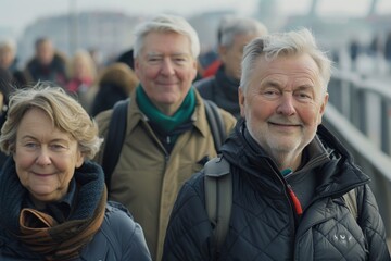 Portrait of happy senior men and women standing on the bridge.