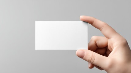 Blank White Business Card Mockup Held by Hand in Front View