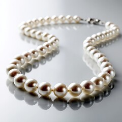 Fototapeta premium Elegant String of Lustrous White Pearls Displayed on a Reflective Surface Highlighting Their Timeless Beauty and Classic Fashion Appeal for Jewelry Enthusiasts
