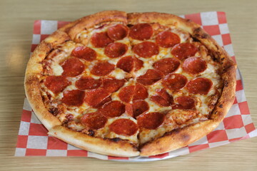 A mouthwatering classic pepperoni pizza with a golden, crispy crust, melted cheese, and rich toppings, perfect for sharing with friends or enjoying alone at any gathering.