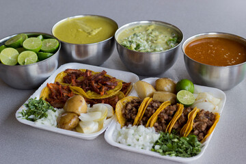 This spread features an assortment of delicious tacos adorned with various toppings, paired with flavorful sides, representing a vibrant culinary landscape full of taste.
