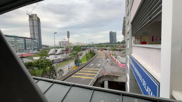 a view in front of Terminal Bersepadu Selatan or TBS bus station in KL. road and buildings view from TBS bridge. major transportation hub intercity bus