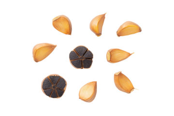 Whole black garlic bulb overhead flat-lay isolated on transparent background