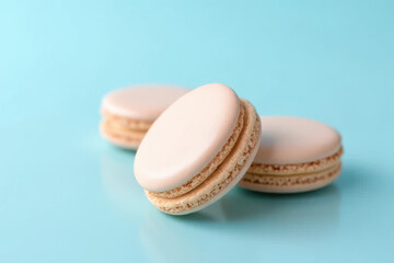 Fototapeta premium Delicious Macarons in Cozy Breakfast Corner: Pastel Blue Background, Clean Food Photography, Hard Side Light, Spacious Layout