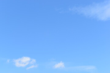 beautiful blue sky and white fluffy group of clouds with sunrise in the morning, natural background