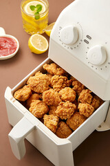 Fried chicken nuggets with lemon juice and ketchup