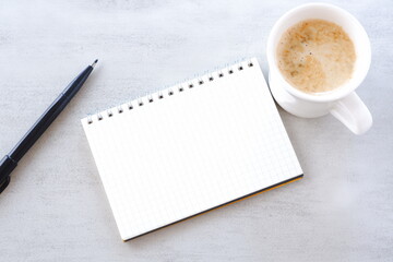 Memo Pad and pen with cup of Coffee
