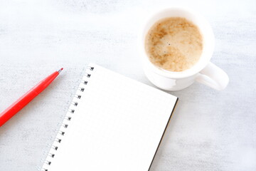 Memo Pad and pen with cup of Coffee

