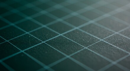 Close-up of a Green Cutting Mat with a Grid Pattern