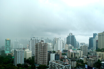Cityscape of Bangkok on a Cloudy and Rainy Day – Urban Skyline with Overcast Sky and Wet Weather Atmosphere