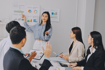 Team of financial advisory services. Asian advisor showing plan of investment to clients in the consultancy office..