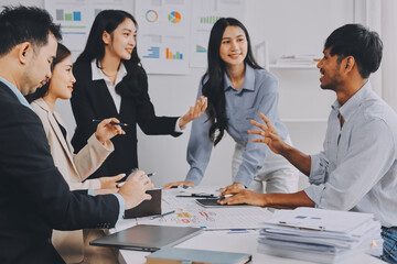 Team of financial advisory services. Asian advisor showing plan of investment to clients in the consultancy office..