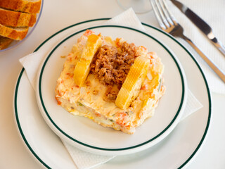 Banquet in the restaurant - Spanish salad with potatoes, tuna, olives and egg
