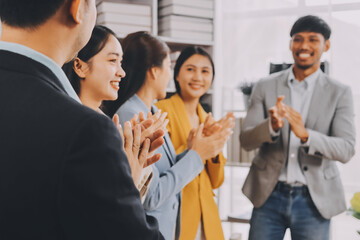 Obraz premium Conference, team of coworkers clapping hands for success and in boardroom of presentation with lens flare. Support, achievement and diverse group of people applauding together in business meeting