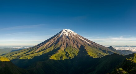 Fototapeta premium Mountain Peak with Snow Cap Under Blue Sky at Daytime