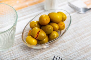 Pickled green olives with a stone - a typical Spanish tapas