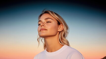 Peaceful woman gazing at sunset