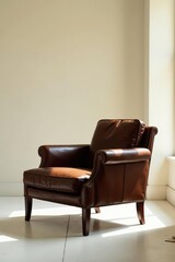 Fototapeta premium A comfortable brown leather armchair sits in a sunlit room, offering a relaxing and sophisticated ambiance