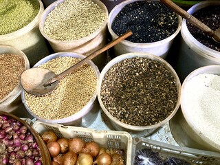 assorted grain and peas on a traditional market display