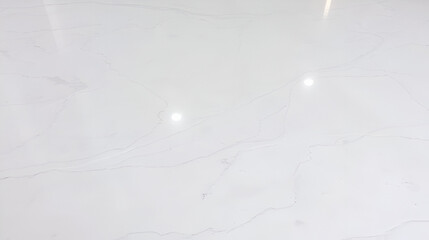 Surface of a polished marble floor, emphasizing the smooth finish and natural veining
