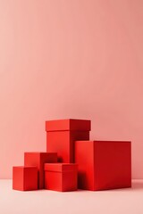 Obraz premium A vibrant composition of crimson gift boxes arranged asymmetrically against a soft pink backdrop