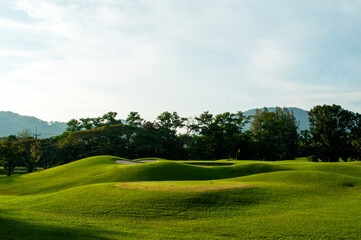 Scenic View of a Lush Green Golf Course &ndash; Manicured Fairways and Natural Landscape
