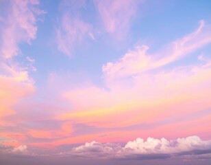 Fototapeta premium A breathtaking sunset paints the sky in vibrant shades of pink, with wispy clouds softly illuminated, creating a serene and dreamy atmosphere.