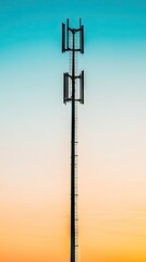 Obraz premium Tall metal telecommunications tower against a gradient sky