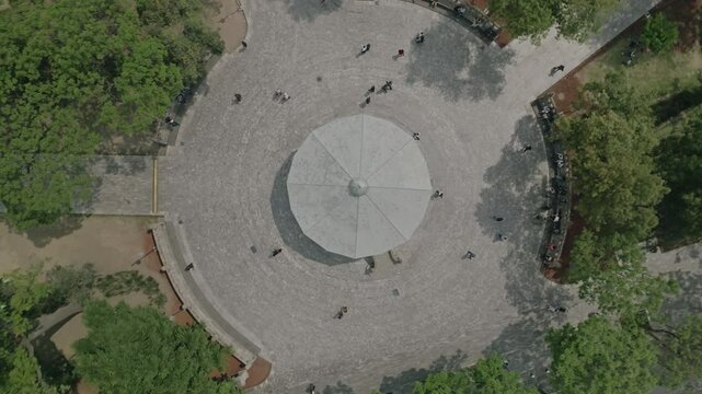 Aerial drone shot over pathways and gardens in Alameda Central