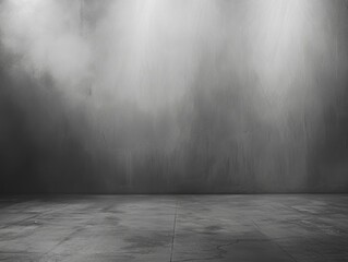 Empty dark gray room with concrete floor and textured wall in studio lighting, low angle minimalist shot for background or product display