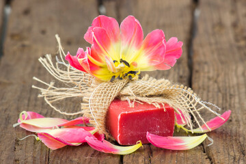 bar of natural soap and tulip flower