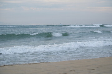 Soft blue ocean wave on sandy beach. Background.