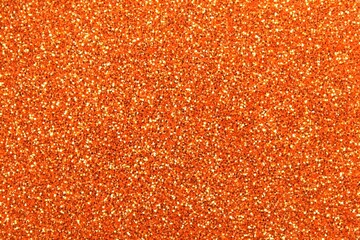 Orange Glitter Texture Christmas Background Sparkling with Festive Warmth and Seasonal Cheer