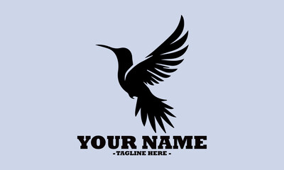 Fototapeta premium Silhouette vector illustration of hummingbird flying with wings fully spread expressing freedom and grace in minimalist design and logo vector hummingbird design