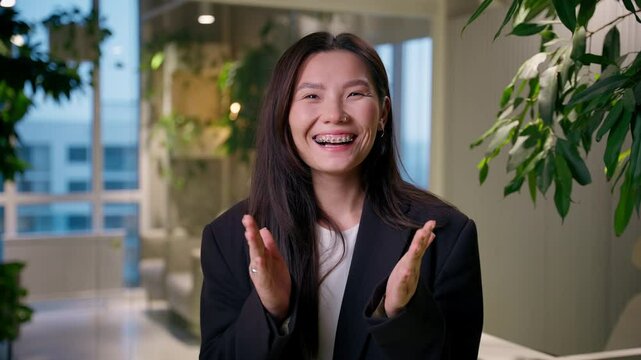 Happy surprised Asian businesswoman amazed shocked Chinese Korean Japanese business woman shock open mouth amazing impress excited female manager wow unbelievable good news job offer in office company