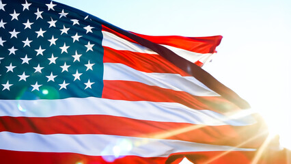 American flag waves gracefully in the sunlit breeze, emblem of freedom and patriotism