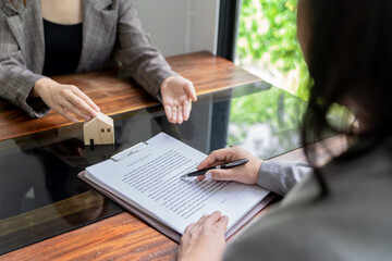 Business people signing contract making deal with real estate agent Concept for consultant home insurance.Real estate investment Property insurance security.