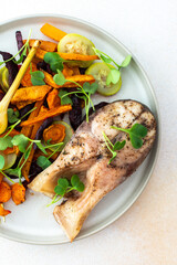Savor baked silver carp with a mix of roasted carrots, zucchini, beets, and garlic, healthy and delicious breakfast or lunch