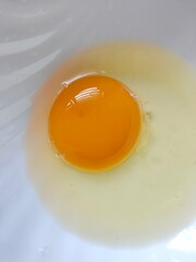 Broken egg in a bowl