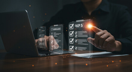 Person interacting with a digital interface, showing checklists and compliance documents, alongside a laptop in a dark office setting.