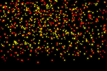 A black background filled with many small red and yellow stars scattered across the entire image space