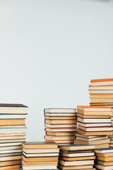 Stacks of educational books for learning on a white background