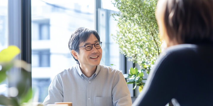 Business scene with a woman and a man talking peacefully.