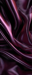 Obraz premium Rich maroon and dark purple luxury silk fabric texture, elegant background for high-fashion banners, premium print designs, and sophisticated website backdrops.