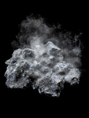 Asteroid fragment floating in space with dust cloud against black backdrop studio shot