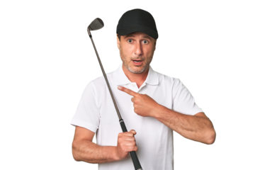 Middle aged golfer man pointing to the side