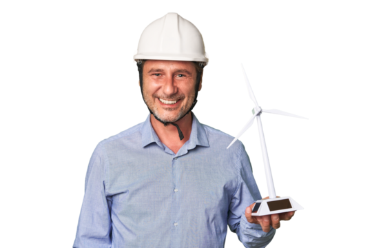 A middle-aged architect man holds a windmill isolated