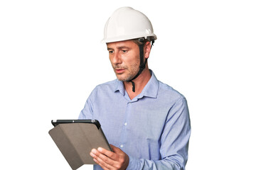 Tech-savvy architect using tablet for work, studio shot.