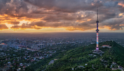 Mount Kok-Tobe (Blue Hill) with the famous TV tower in the Kazakh city of Almaty on a spring evening
